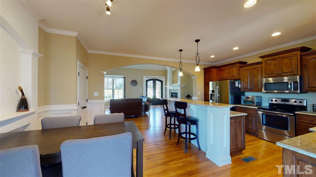 3537 Saddle Ridge Road Stem, NC 27581 - Photo 13 of 29 a view of kitchen with dining table and chairs