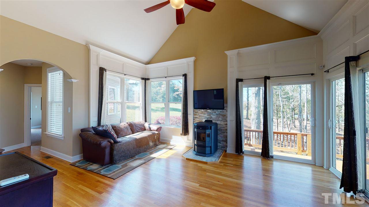 3537 Saddle Ridge Road Stem, NC 27581 - Photo 14 of 29 a living room with furniture and a flat screen tv
