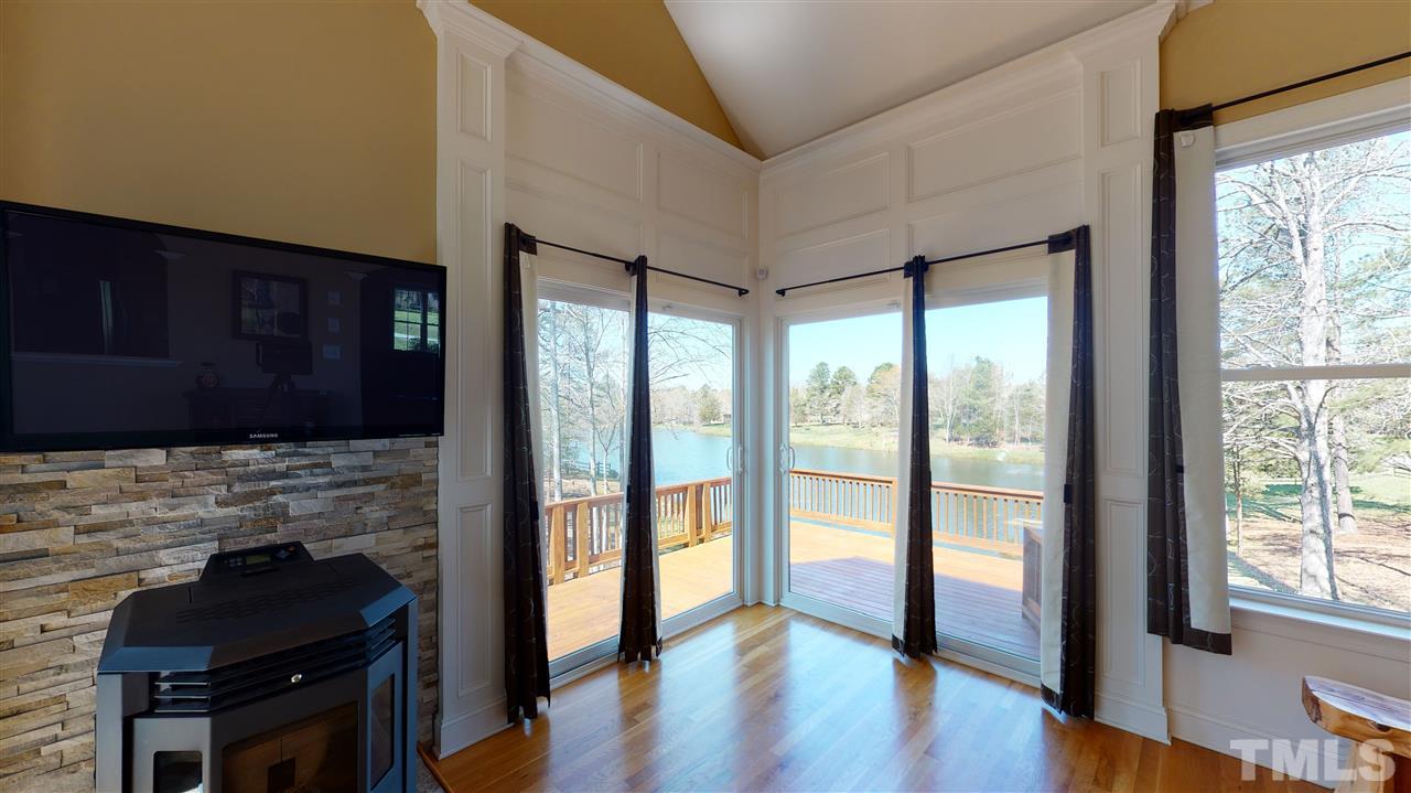 3537 Saddle Ridge Road Stem, NC 27581 - Photo 15 of 29 a room with wooden floor and a fireplace