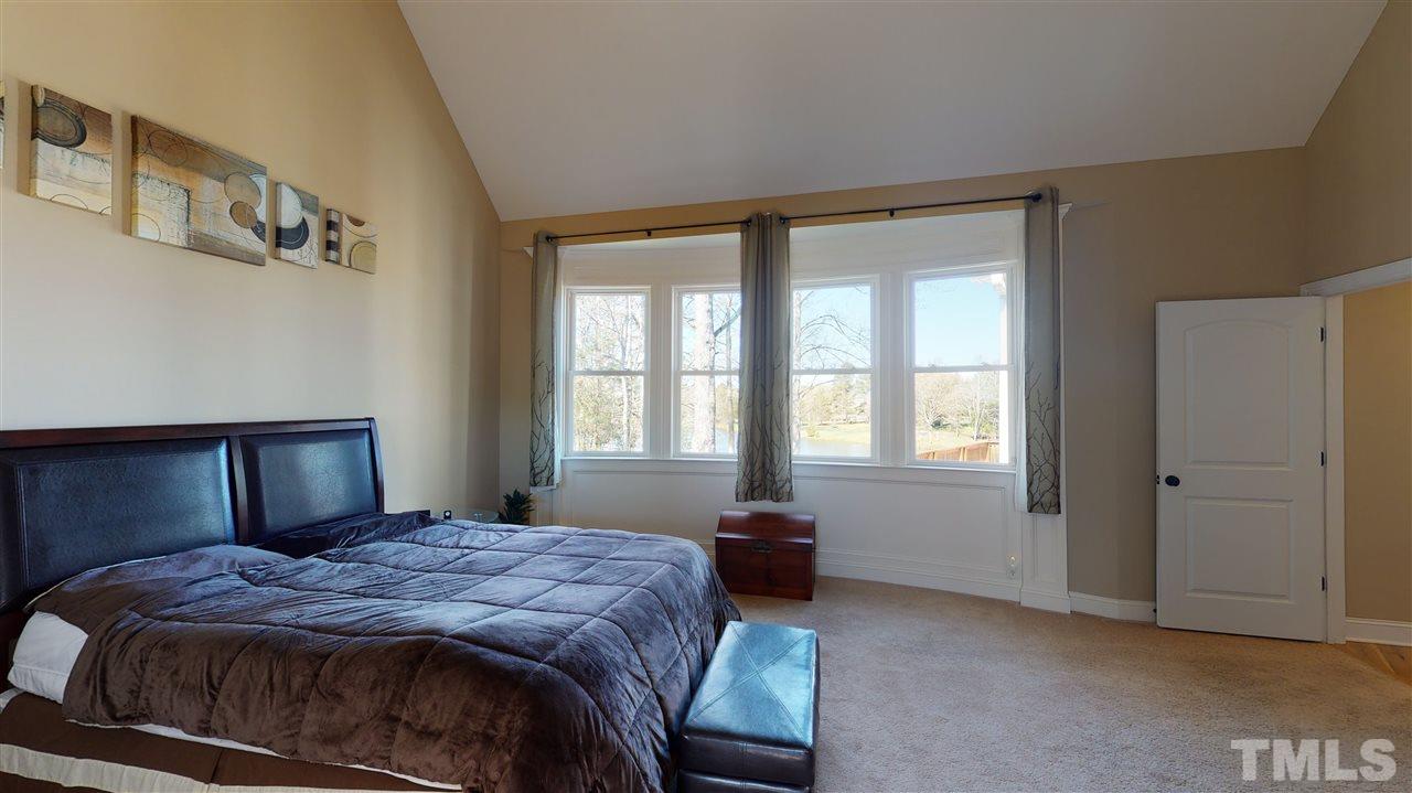 3537 Saddle Ridge Road Stem, NC 27581 - Photo 18 of 29 a bedroom with a bed and a window