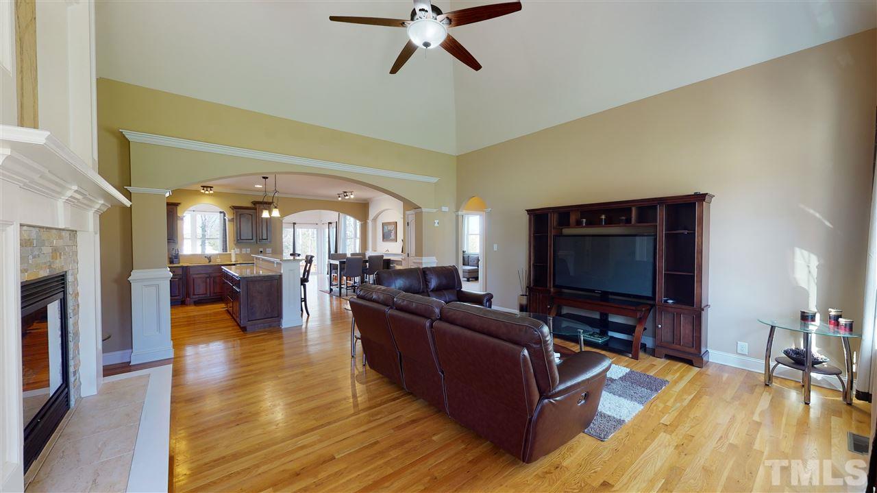 3537 Saddle Ridge Road Stem, NC 27581 - Photo 3 of 29 a living room with furniture and a flat screen tv