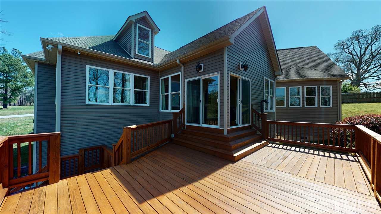 3537 Saddle Ridge Road Stem, NC 27581 - Photo 24 of 29 a view of a house with a roof deck