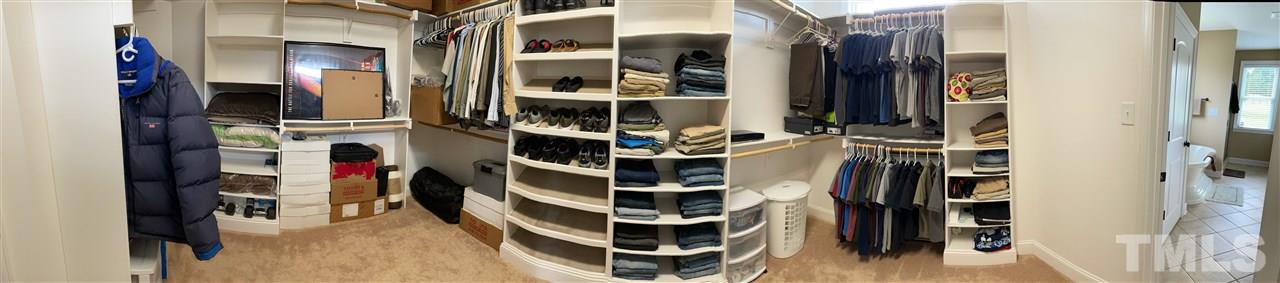 3537 Saddle Ridge Road Stem, NC 27581 - Photo 29 of 29 a view of walk in closet with clothes and shoes