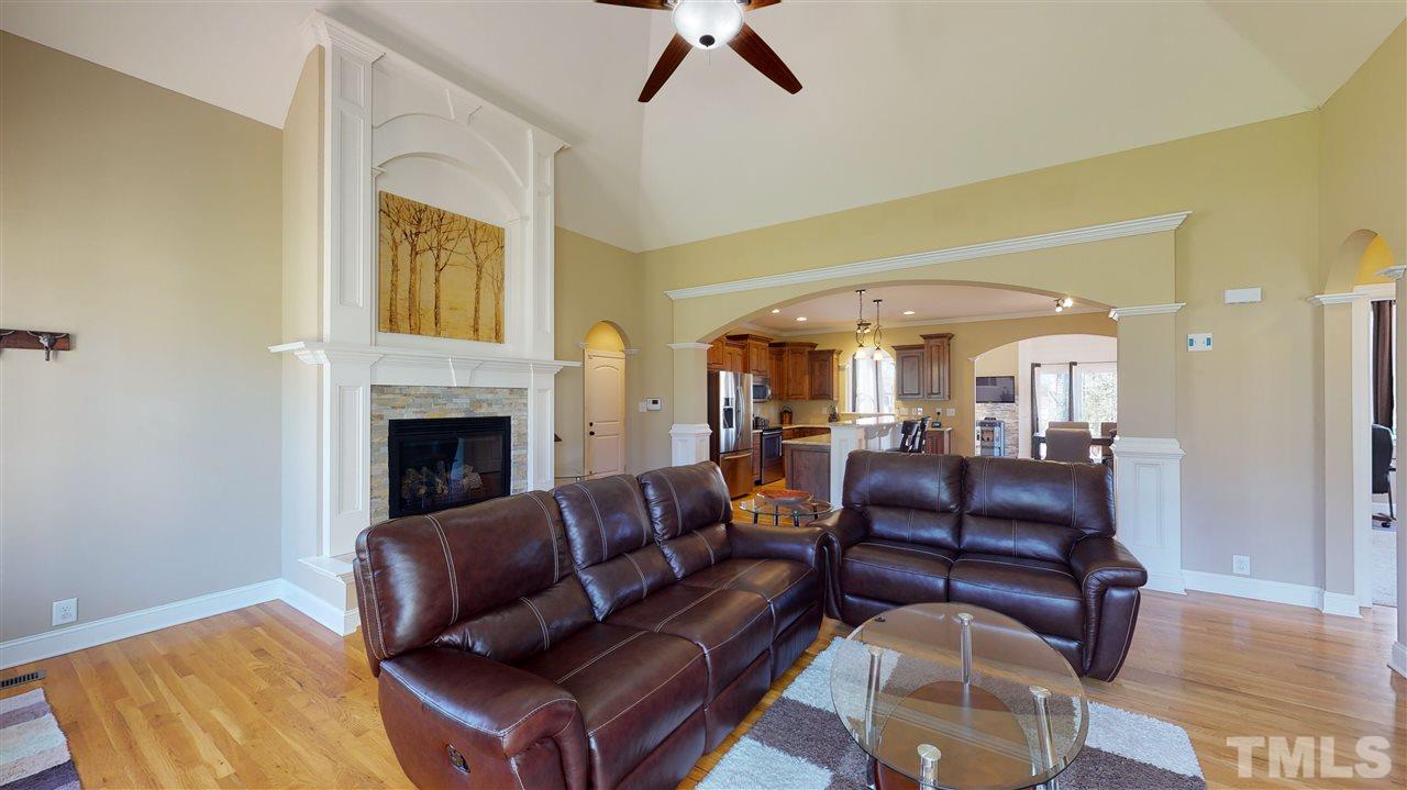 3537 Saddle Ridge Road Stem, NC 27581 - Photo 4 of 29 a living room with furniture and a fireplace