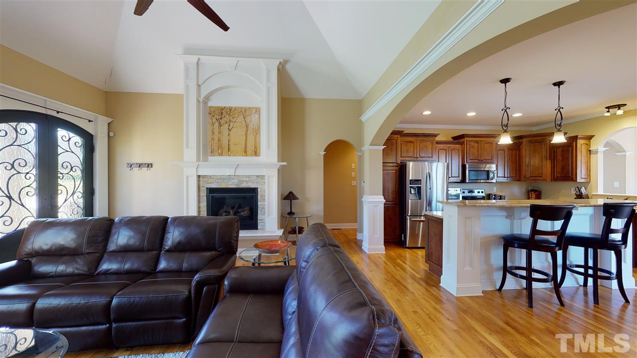 3537 Saddle Ridge Road Stem, NC 27581 - Photo 5 of 29 a living room with furniture and a fireplace