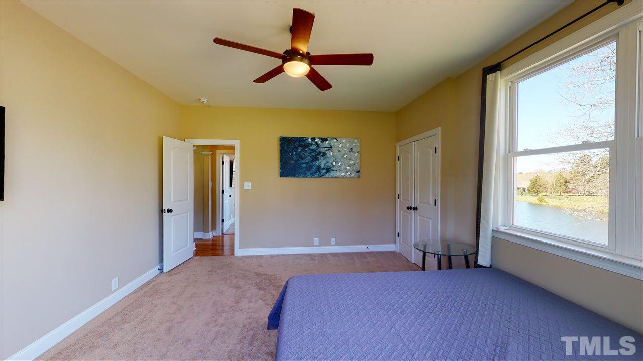 3537 Saddle Ridge Road Stem, NC 27581 - Photo 7 of 29 a bedroom with a bed and a window