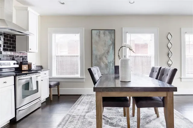 a dining room with furniture and window