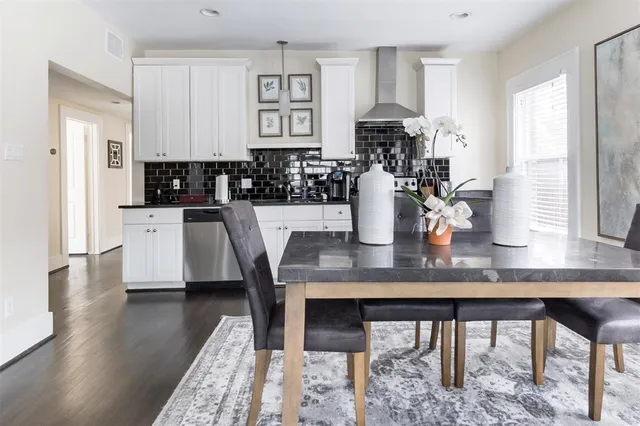 a view of a dining room with furniture and window