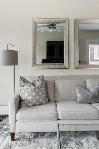 a living room with a couch and a fireplace