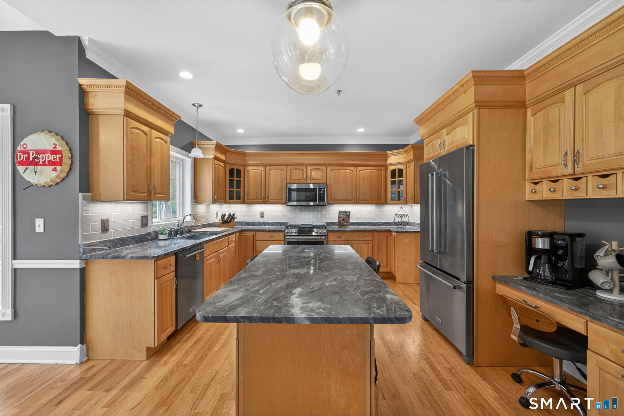 29 Boulder Ridge Southington, CT 06489 - Photo 11 of 40 a kitchen with stainless steel appliances granite countertop a refrigerator a sink dishwasher and wooden cabinets with wooden floor