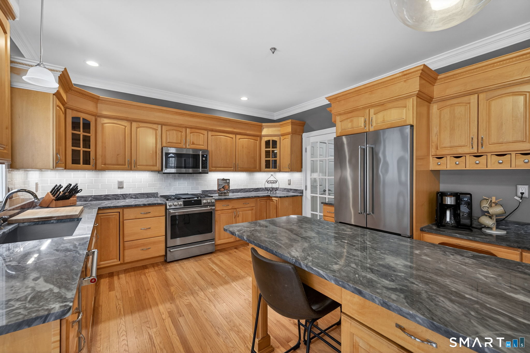 29 Boulder Ridge Southington, CT 06489 - Photo 12 of 40 a kitchen with stainless steel appliances granite countertop a refrigerator a stove top oven a sink and dishwasher