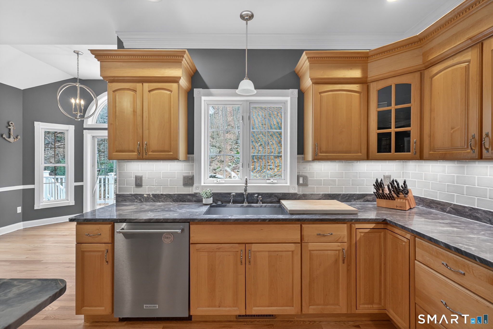 29 Boulder Ridge Southington, CT 06489 - Photo 13 of 40 a kitchen with stainless steel appliances granite countertop a sink a stove cabinets and a dining table
