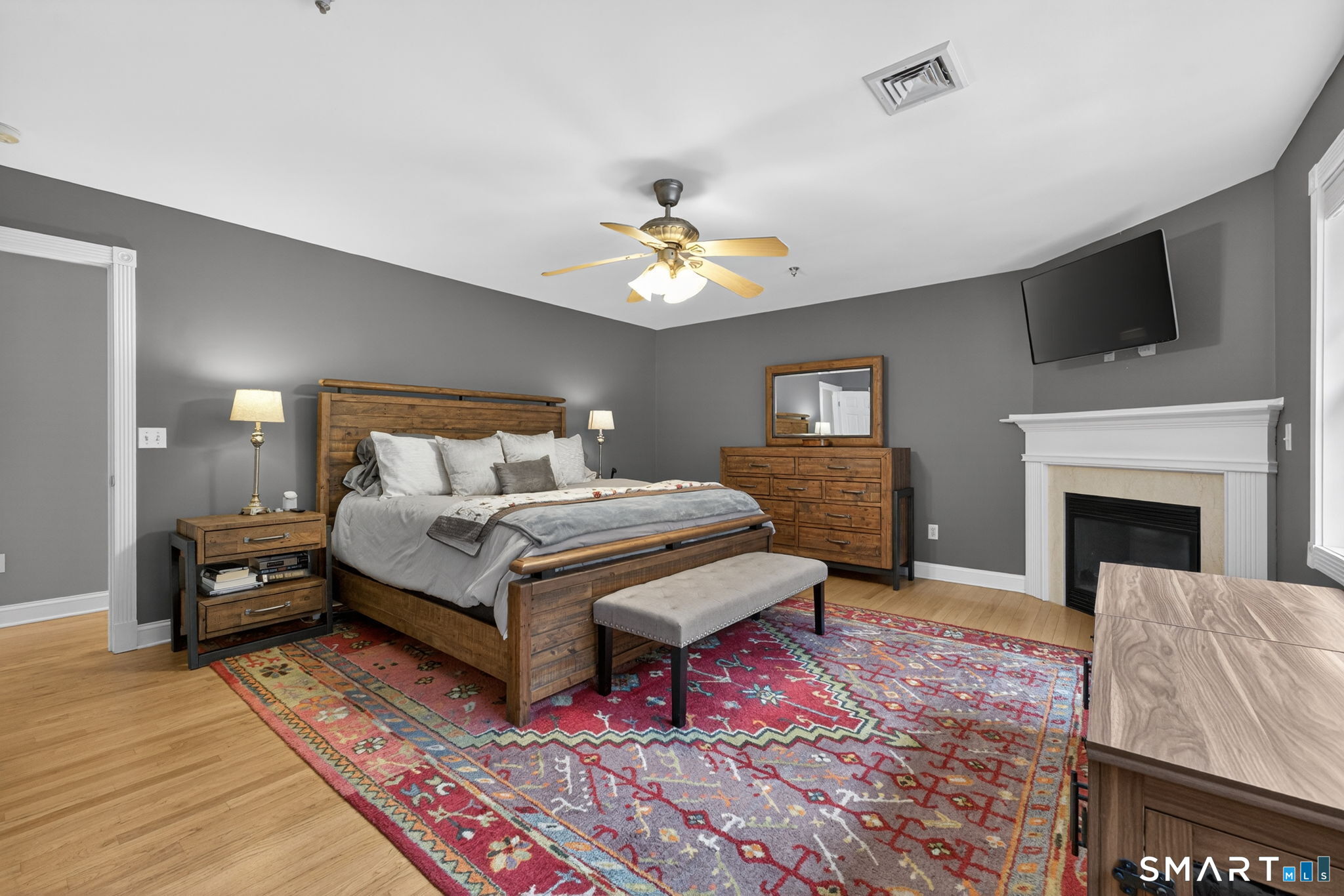 29 Boulder Ridge Southington, CT 06489 - Photo 18 of 40 a bedroom with a bed and a fireplace