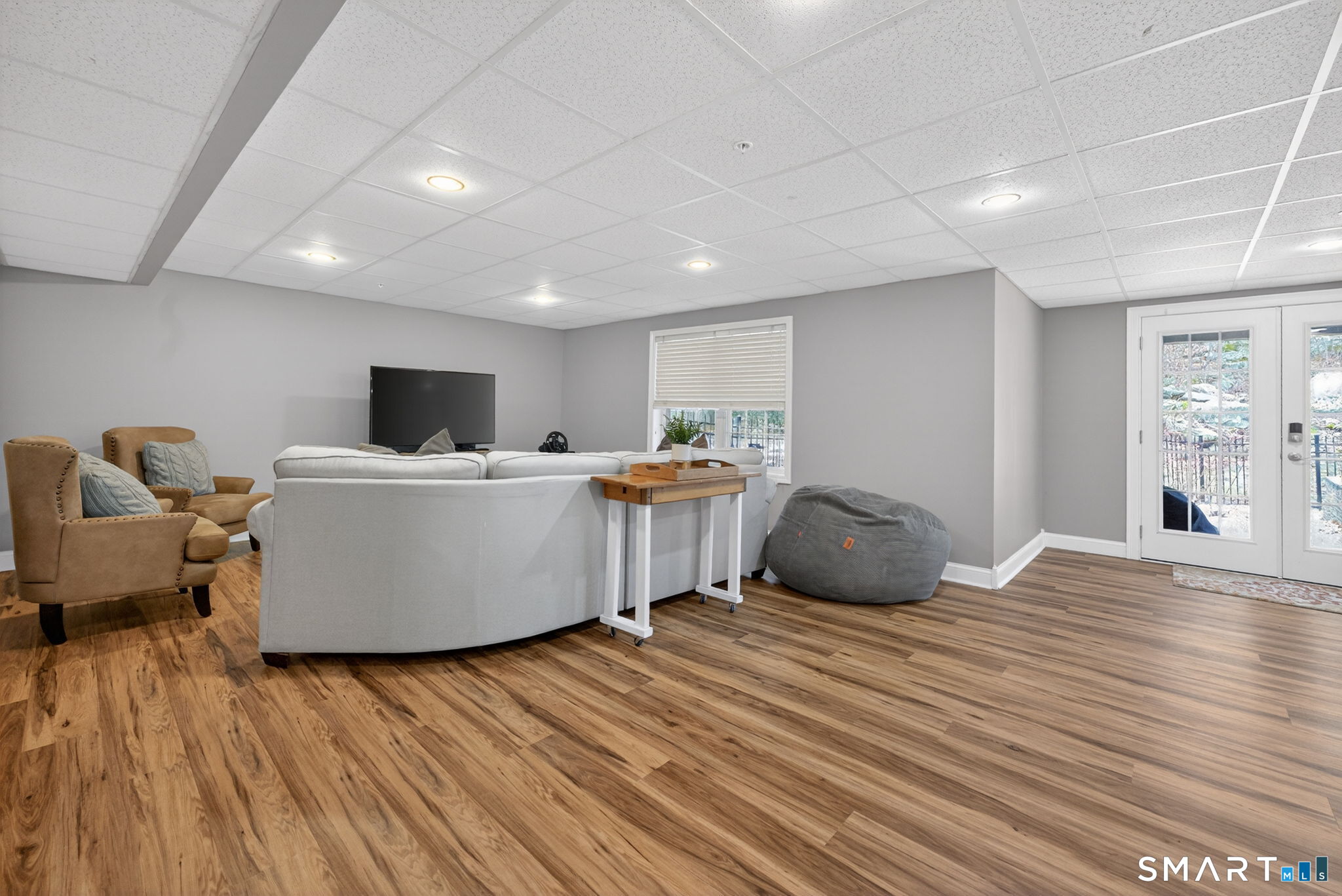 29 Boulder Ridge Southington, CT 06489 - Photo 29 of 40 a living room with a couch and a wooden floor