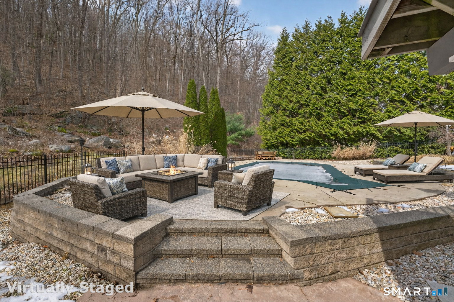 29 Boulder Ridge Southington, CT 06489 - Photo 37 of 40 a view of a patio with couches and a table and chairs under an umbrella