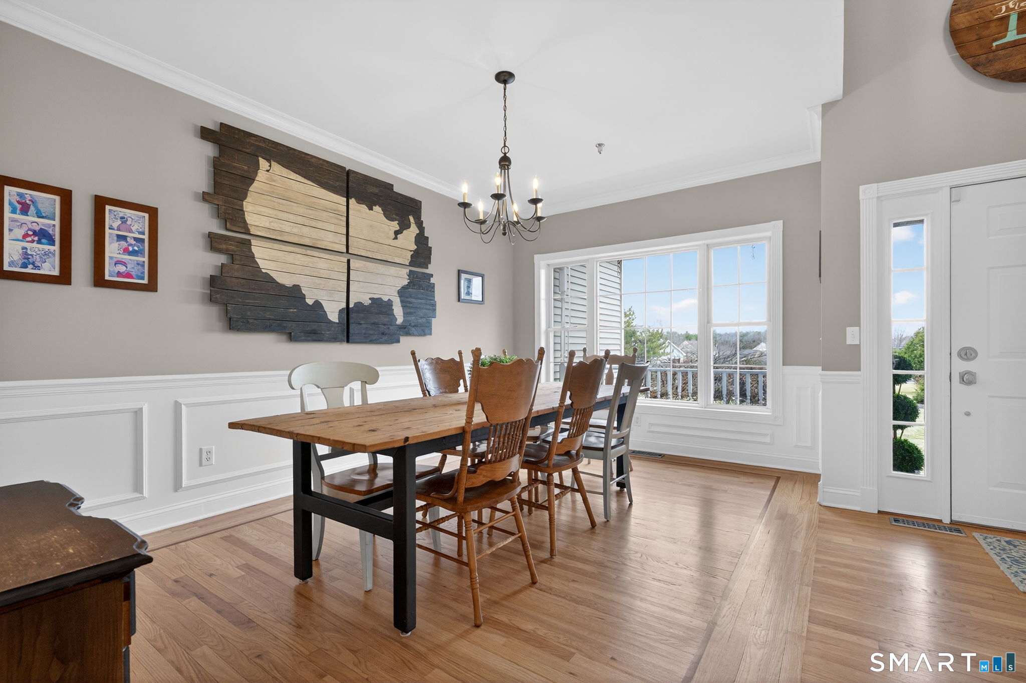 29 Boulder Ridge Southington, CT 06489 - Photo 6 of 40 a view of a dining room with furniture a chandelier and wooden floor