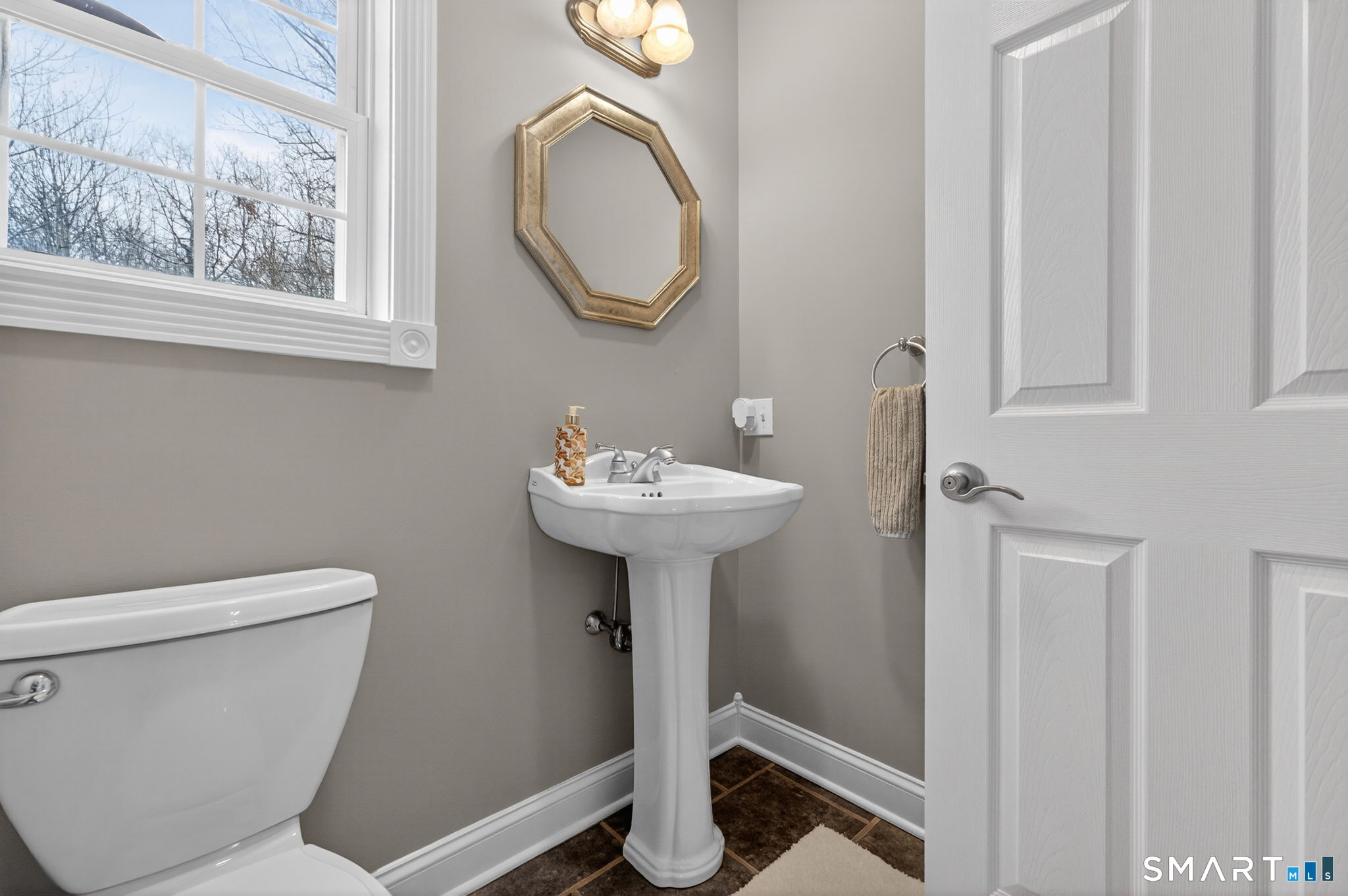 29 Boulder Ridge Southington, CT 06489 - Photo 8 of 40 a bathroom with a toilet sink and mirror