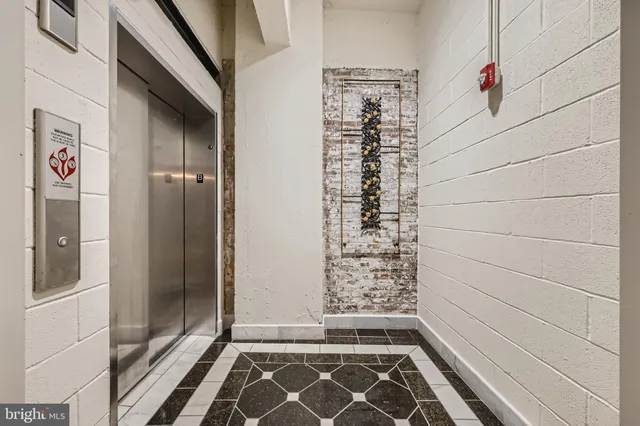 a view of a street with wooden fence