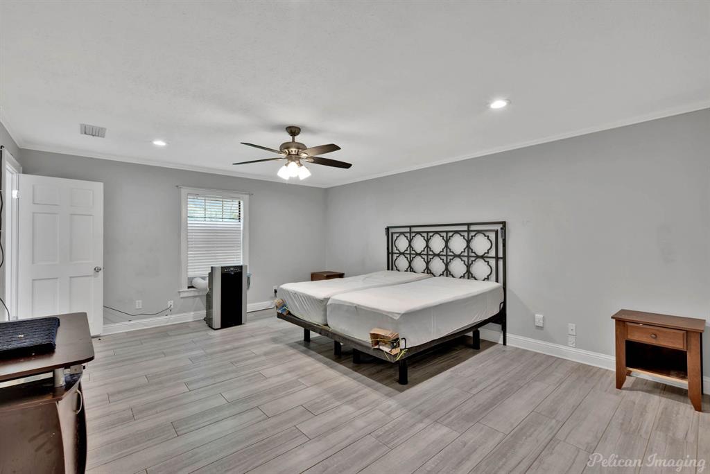 8344 Odom Road Greenwood, LA 71033 - Photo 14 of 39 Bedroom featuring crown molding, light wood-style floors, recessed lighting, and ceiling fan