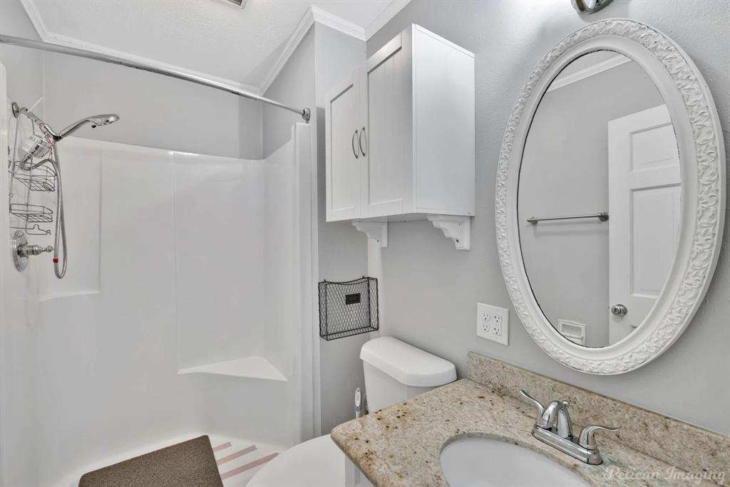 8344 Odom Road Greenwood, LA 71033 - Photo 17 of 39 Full bath featuring a shower, vanity, and crown molding