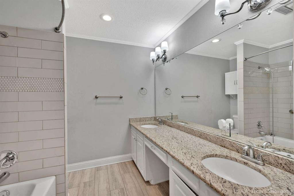 8344 Odom Road Greenwood, LA 71033 - Photo 18 of 39 Full bathroom featuring shower / bath combination, double vanity, crown molding, recessed lighting, and wood finished floors