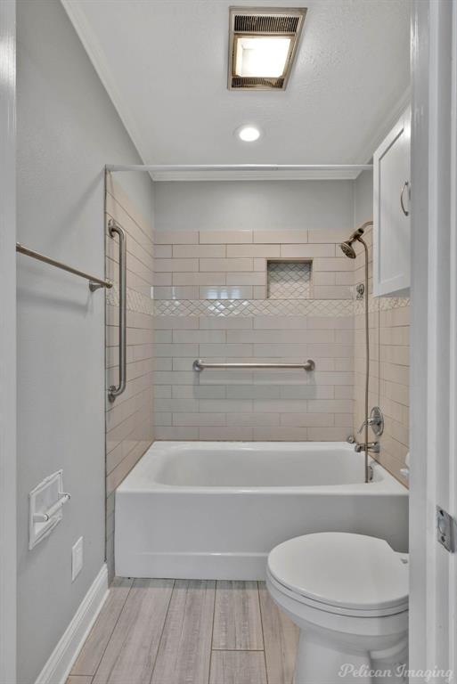 8344 Odom Road Greenwood, LA 71033 - Photo 22 of 39 Full bath featuring tub / shower combination, wood finished floors, and recessed lighting