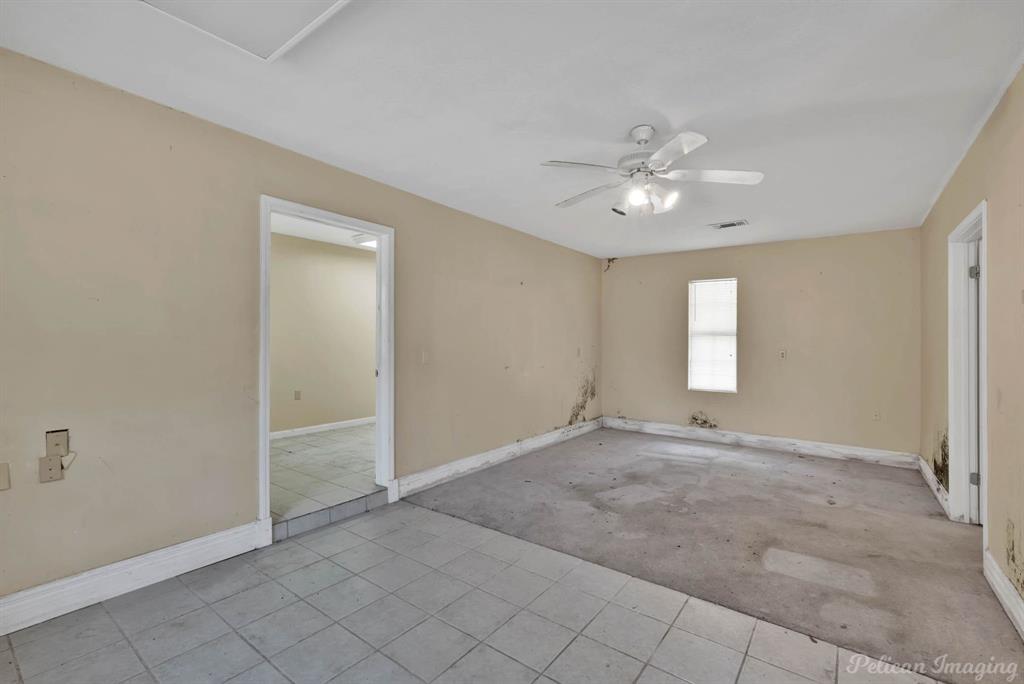 8344 Odom Road Greenwood, LA 71033 - Photo 29 of 39 Guest house - Tiled spare room with baseboards and a ceiling fan