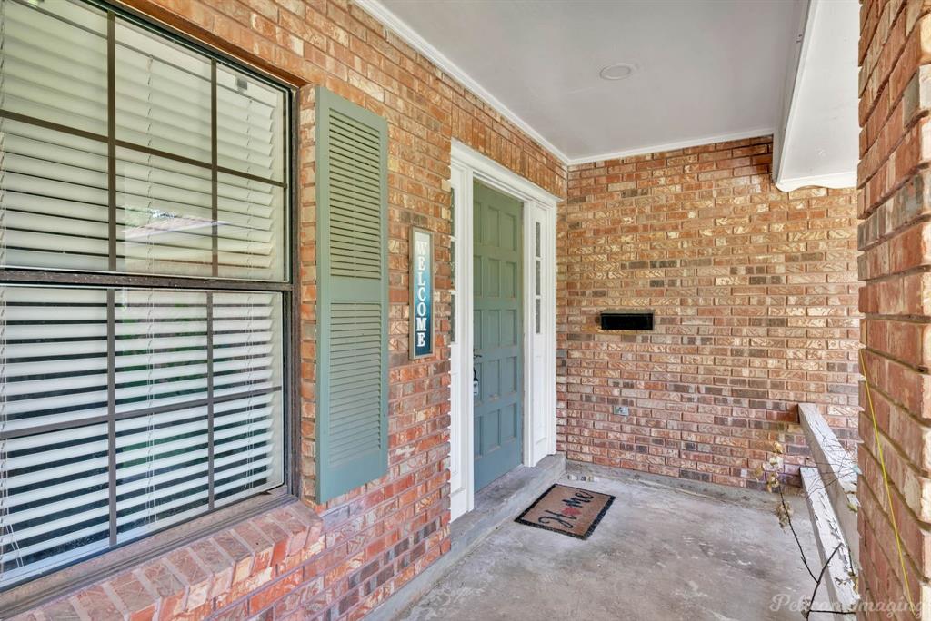 8344 Odom Road Greenwood, LA 71033 - Photo 3 of 39 Property entrance featuring brick siding and covered porch