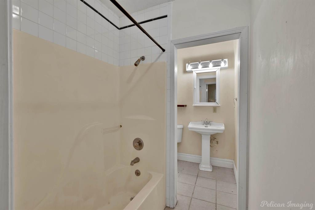 8344 Odom Road Greenwood, LA 71033 - Photo 35 of 39 Guest house - Full bath with tile patterned floors and shower combination