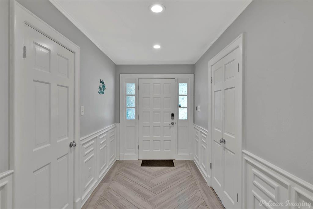 8344 Odom Road Greenwood, LA 71033 - Photo 4 of 39 Entryway featuring a wainscoted wall, a decorative wall, recessed lighting, and crown molding