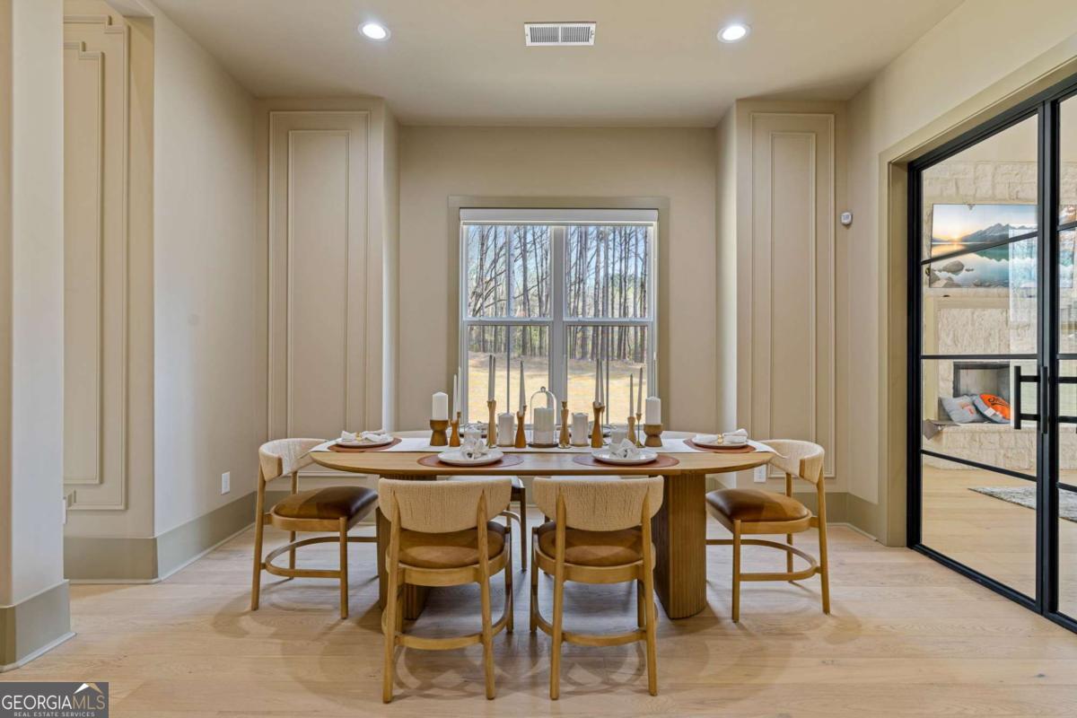 1315 Sandy Creek Road Tyrone, GA 30290 - Photo 45 of 100 a view of a dining room with furniture and window