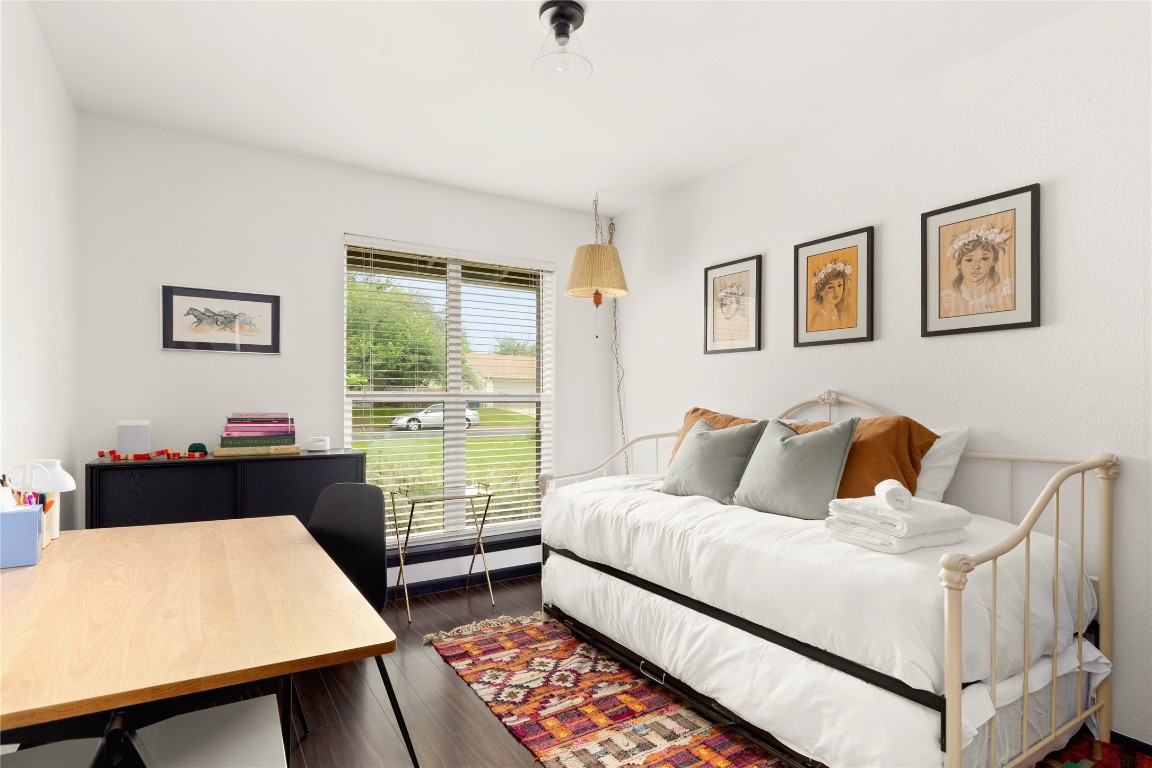705 Battle Bend Boulevard Austin, TX 78745 - Photo 17 of 27 a bedroom with a bed window and table