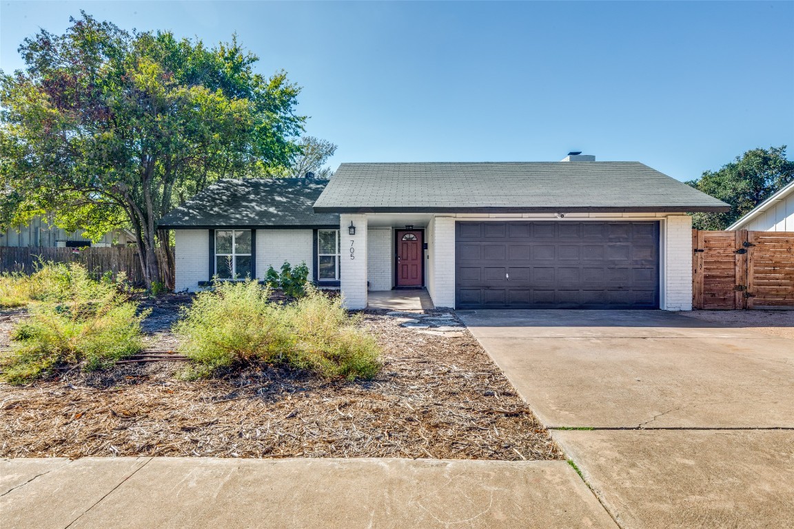 705 Battle Bend Boulevard Austin, TX 78745 - Photo 2 of 27 front view of a house with a yard