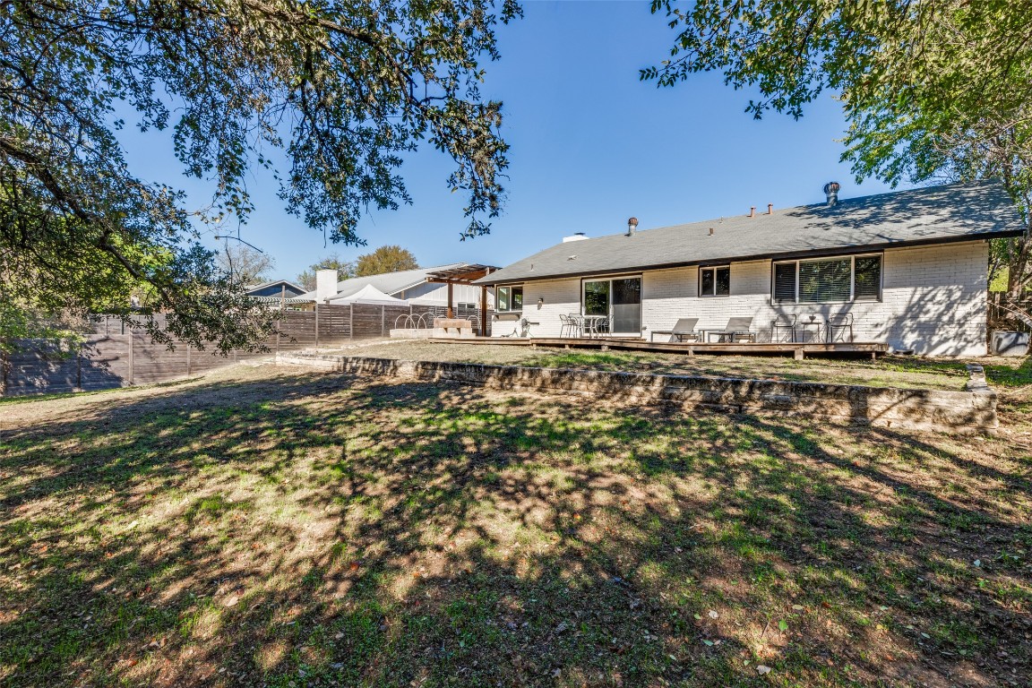 705 Battle Bend Boulevard Austin, TX 78745 - Photo 27 of 27 a backyard of a house with yard and outdoor seating