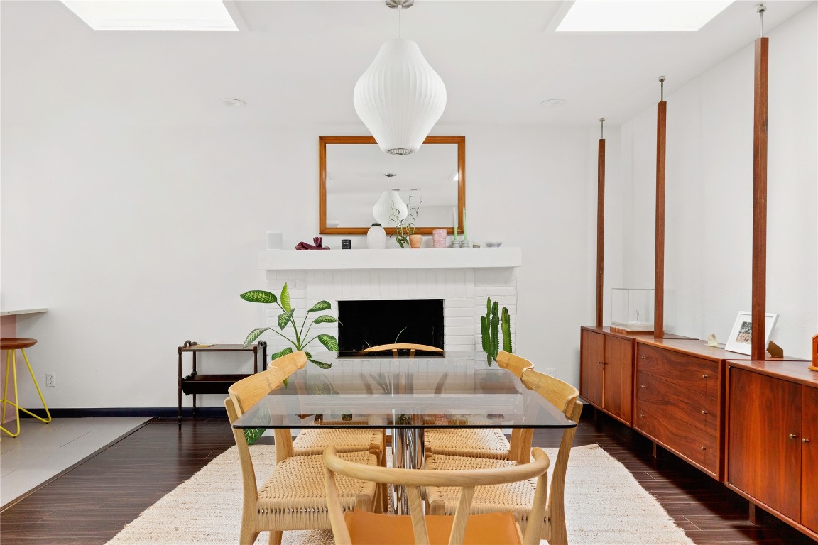 705 Battle Bend Boulevard Austin, TX 78745 - Photo 8 of 27 a view of a dining room with furniture and a fireplace