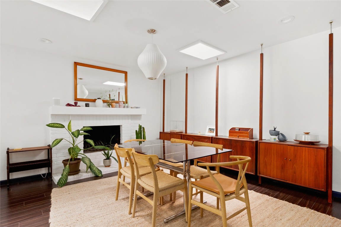 705 Battle Bend Boulevard Austin, TX 78745 - Photo 9 of 27 a dining room with furniture and wooden floor