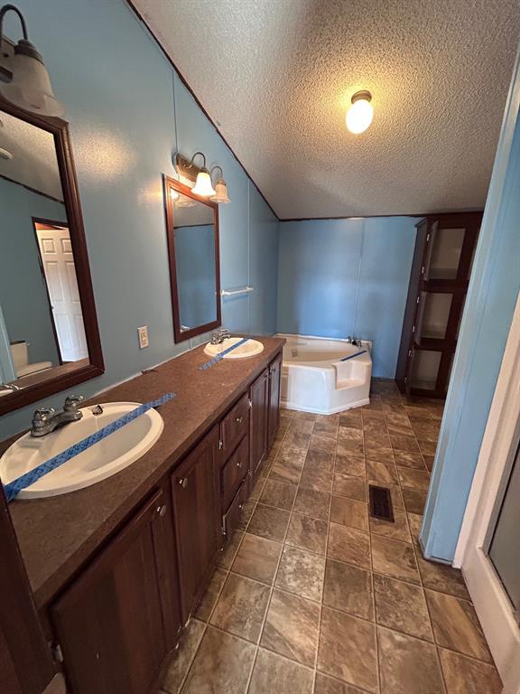 329 Canvas Back Drive Princeton, LA 71067 - Photo 12 of 20 Bathroom with double vanity and a bath