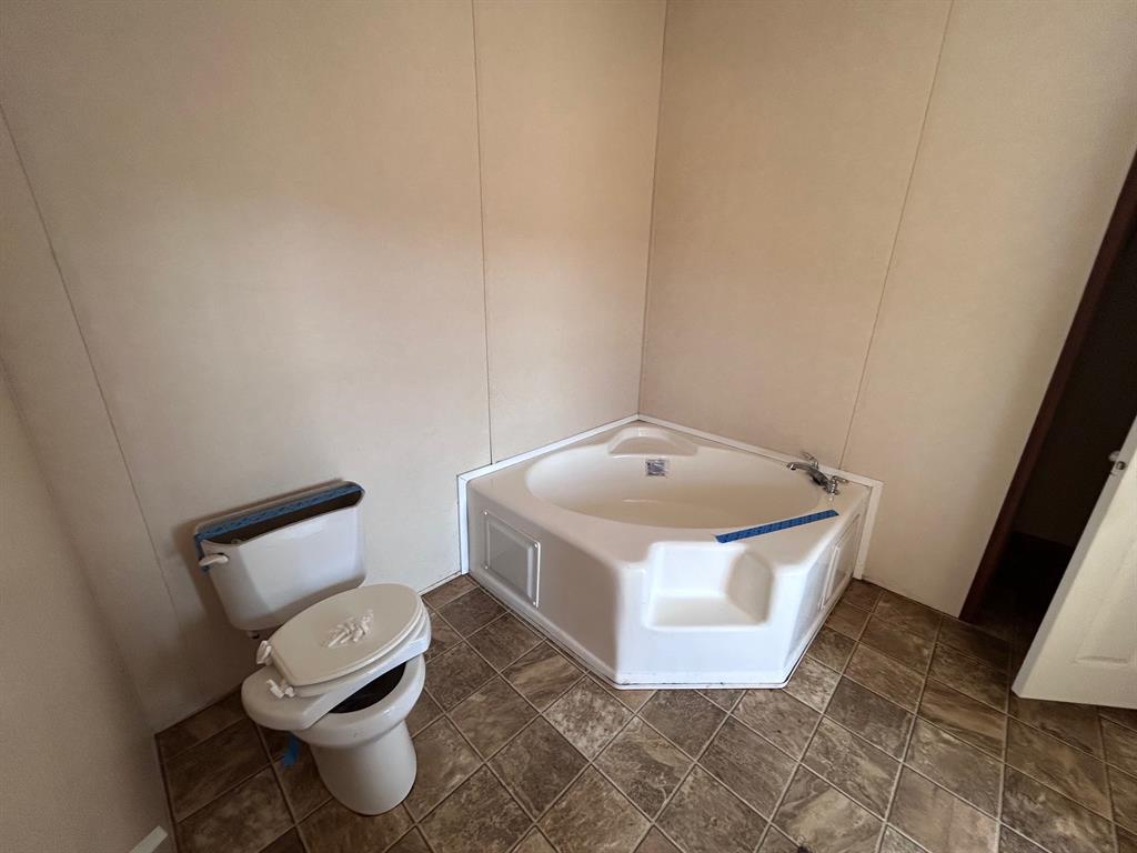 329 Canvas Back Drive Princeton, LA 71067 - Photo 19 of 20 Full bathroom # 3 featuring a bath and a decorative wall