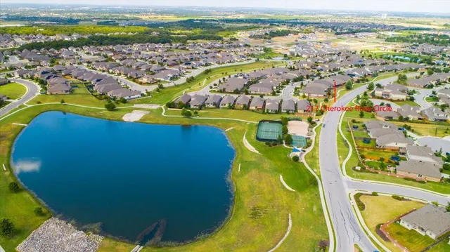 an aerial view of swimming pool with a yard