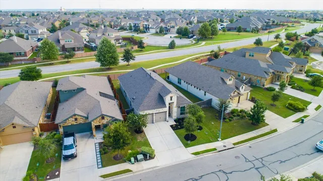 an aerial view of a house with a garden