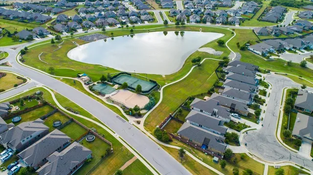 an aerial view of a swimming pool and outdoor space