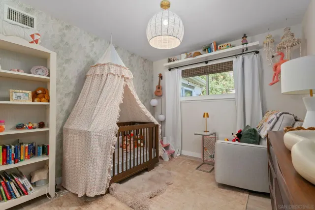 a bedroom with furniture and a book shelf