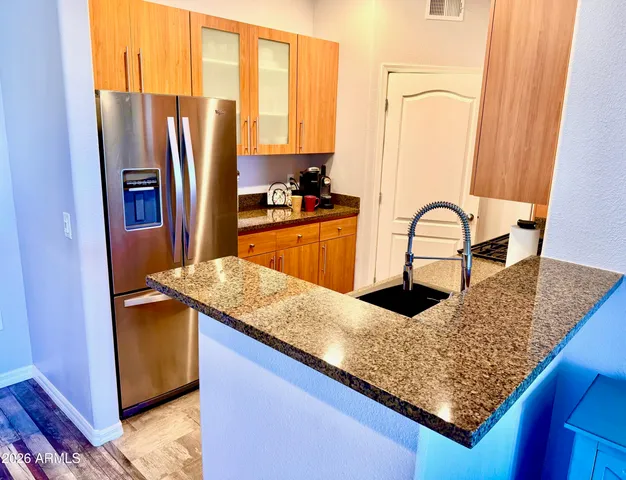 a kitchen with a appliances and a sink