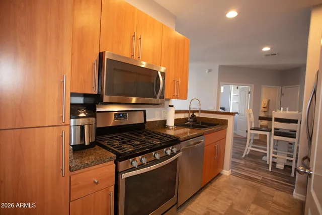 a kitchen with a refrigerator and sink