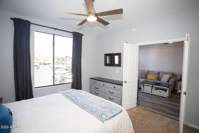 a bedroom with a bed and window