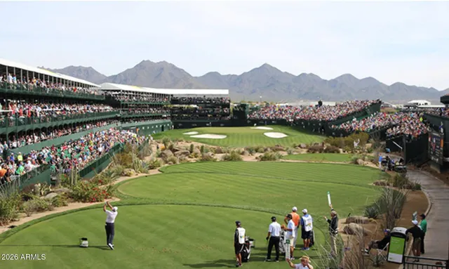 a view of a golf course with a lake