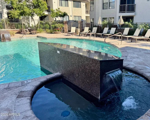 a view of a swimming pool with a patio