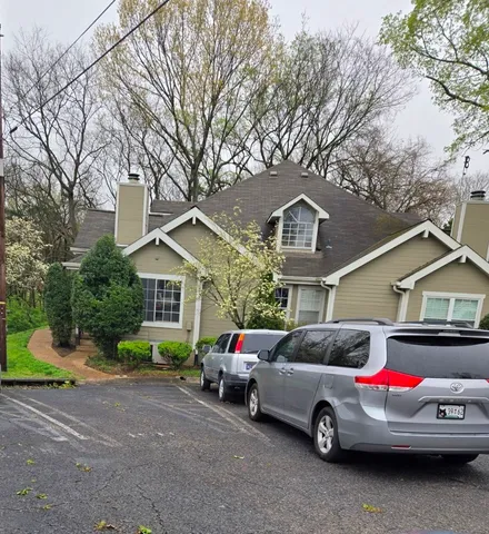 a car parked in front of a house