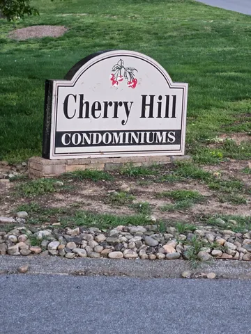 a sign broad in front of a road