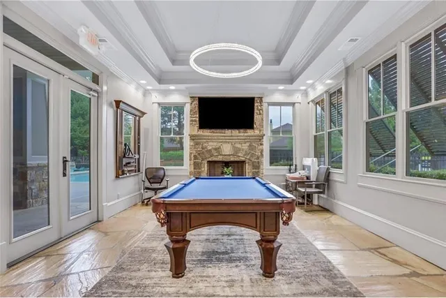 a room with pool table and a flat screen tv